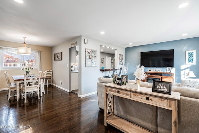 living room featuring dark wood-type flooring