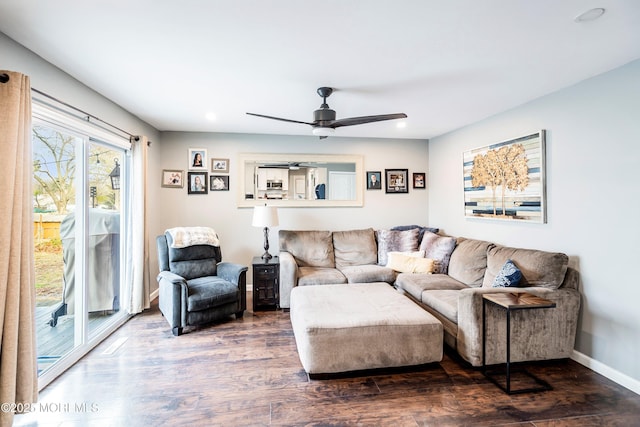 living room featuring hardwood / wood-style flooring and ceiling fan