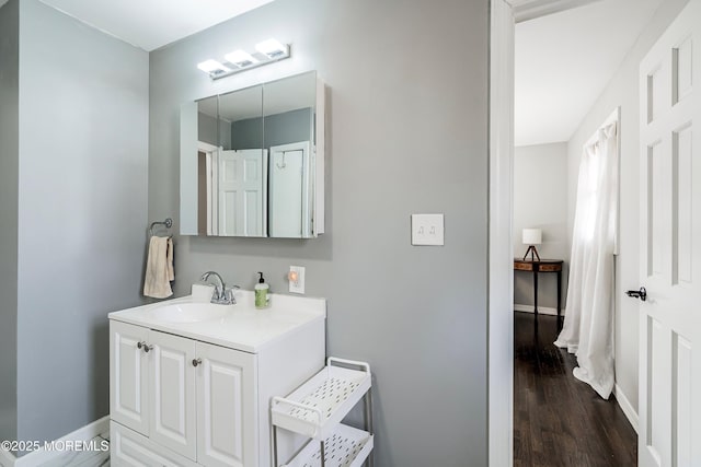 bathroom featuring vanity and hardwood / wood-style floors