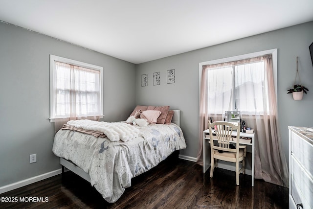 bedroom with dark wood-type flooring