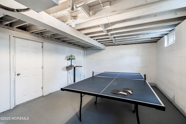 rec room featuring concrete floors