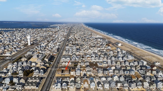 aerial view featuring a view of the beach and a water view