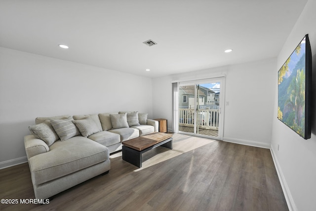 living room featuring dark wood-type flooring