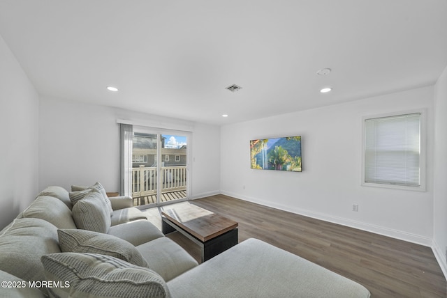 living room featuring dark hardwood / wood-style flooring