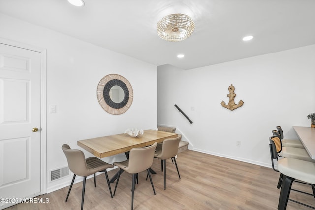 dining area with light hardwood / wood-style floors