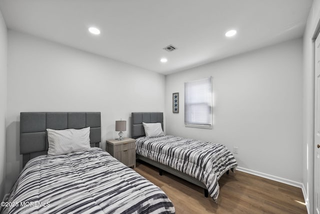 bedroom featuring dark hardwood / wood-style floors