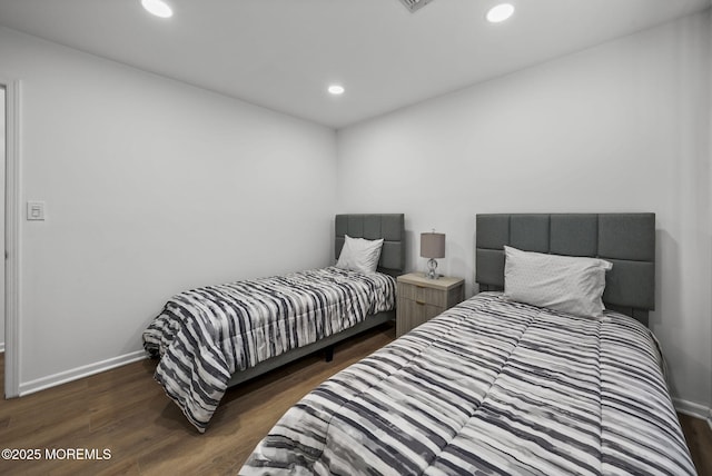 bedroom featuring dark wood-type flooring