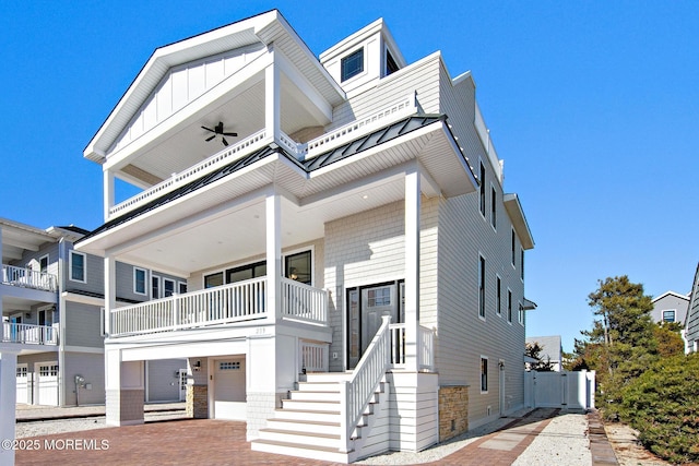 townhome / multi-family property with a garage and ceiling fan