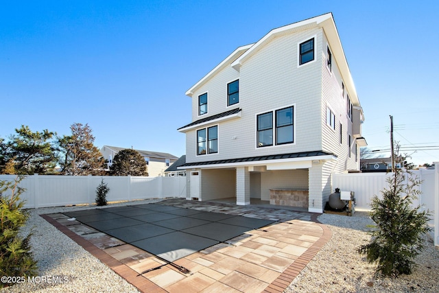 rear view of house with a patio