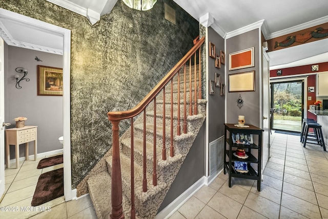 stairway featuring tile patterned flooring and crown molding