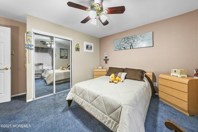 carpeted bedroom with ceiling fan and a closet