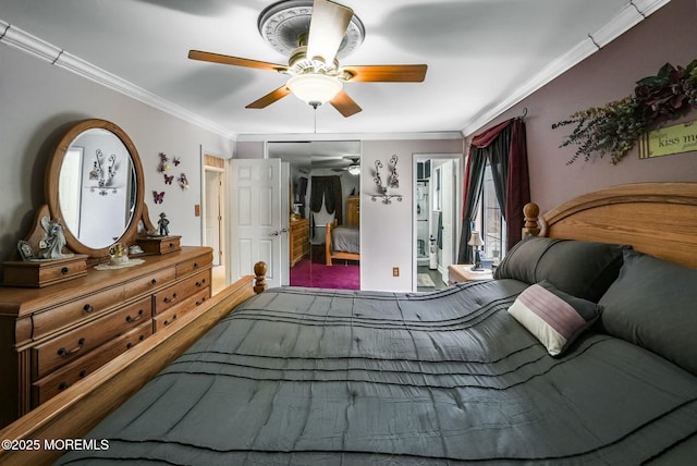 bedroom with ornamental molding and ceiling fan