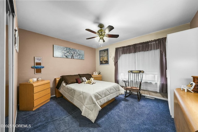 carpeted bedroom with ceiling fan