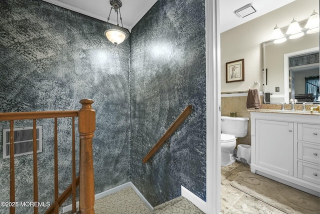 bathroom featuring tile walls, vanity, lofted ceiling, and toilet