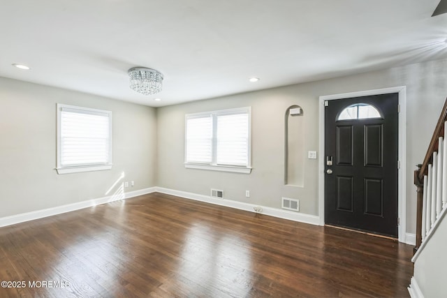 entrance foyer featuring dark hardwood / wood-style flooring