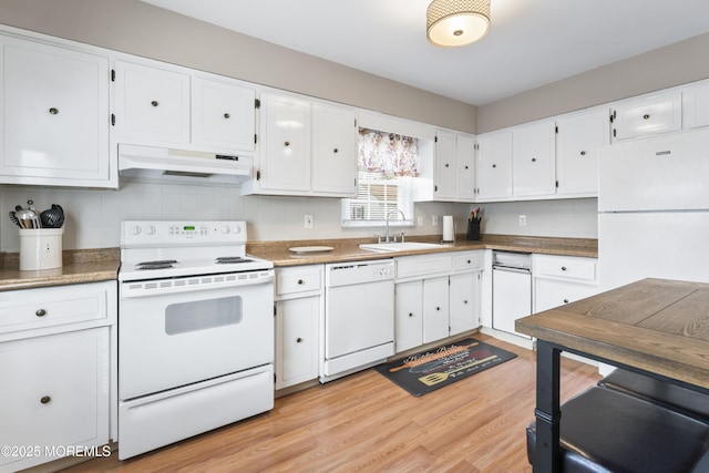 kitchen with sink, white cabinetry, light wood-type flooring, white appliances, and backsplash