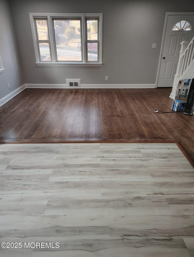 unfurnished room with light hardwood / wood-style flooring