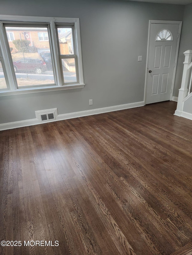 interior space with dark wood-type flooring