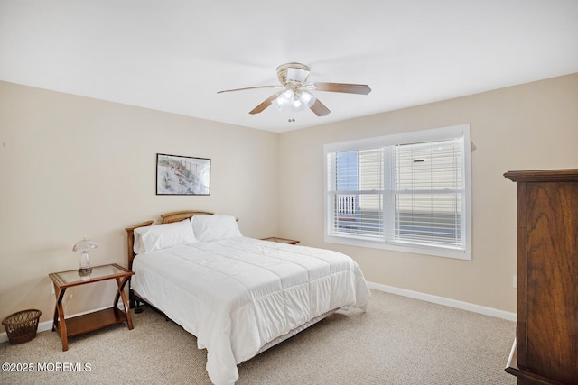 bedroom featuring light carpet and ceiling fan