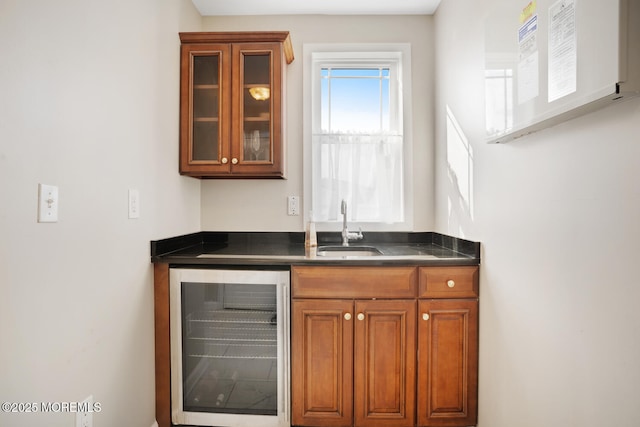 bar with sink and beverage cooler