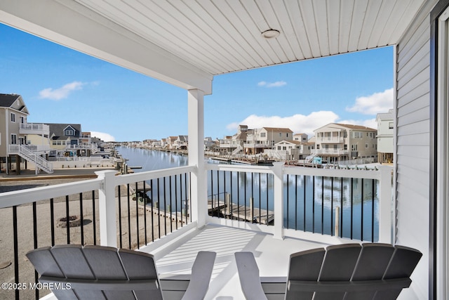 balcony featuring a water view