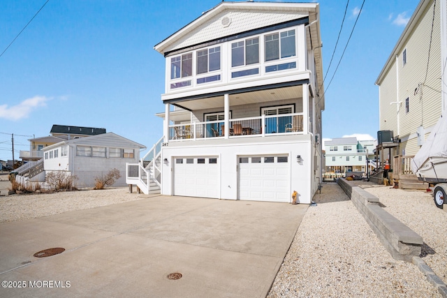 view of front facade with central AC and a garage