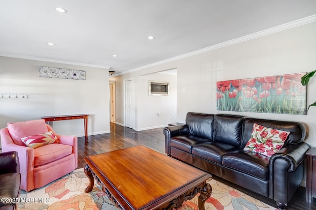 living room with crown molding and hardwood / wood-style floors