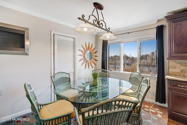 dining area with crown molding