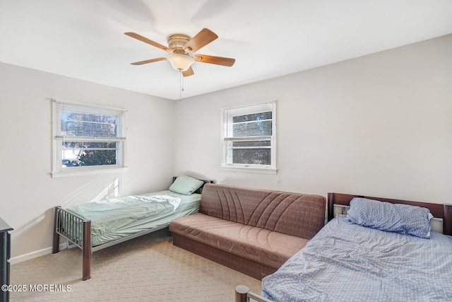 bedroom featuring ceiling fan and carpet flooring