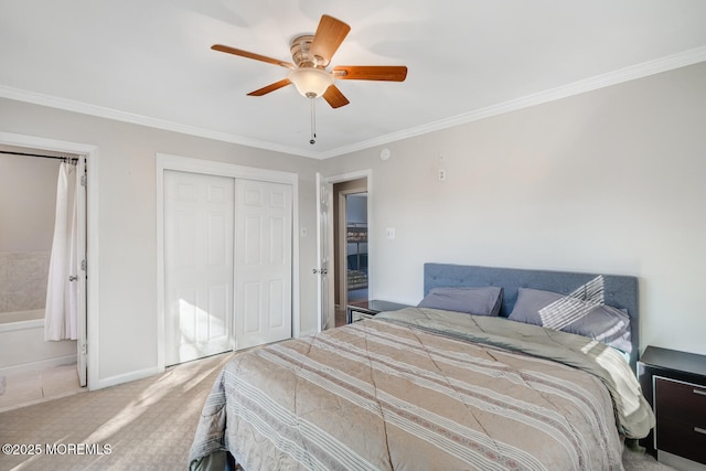 carpeted bedroom with ornamental molding, a closet, and ceiling fan