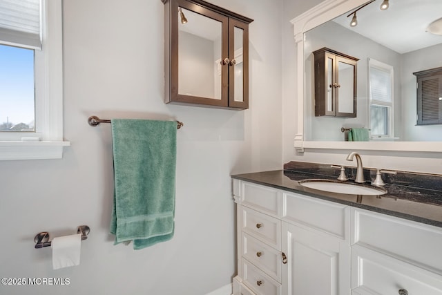 bathroom featuring vanity and track lighting