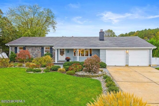 ranch-style home with a garage and a front lawn