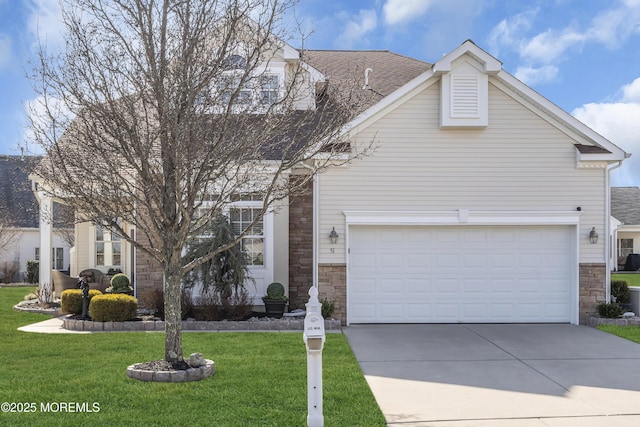 view of front facade featuring a garage and a front lawn