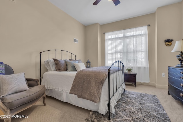 bedroom with light carpet and ceiling fan