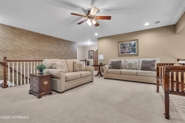 living room with light colored carpet and ceiling fan