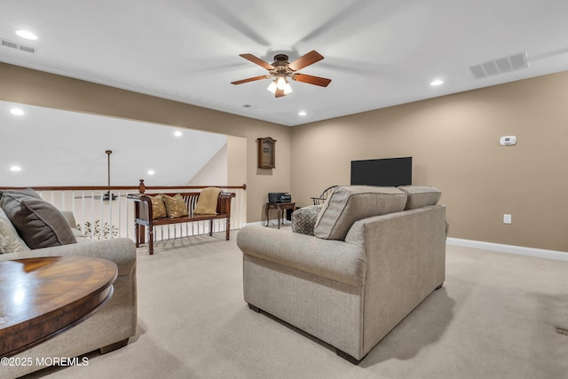 carpeted living room with ceiling fan