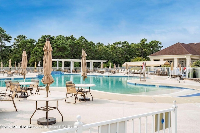 view of swimming pool featuring a patio area