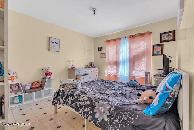 bedroom featuring light tile patterned flooring