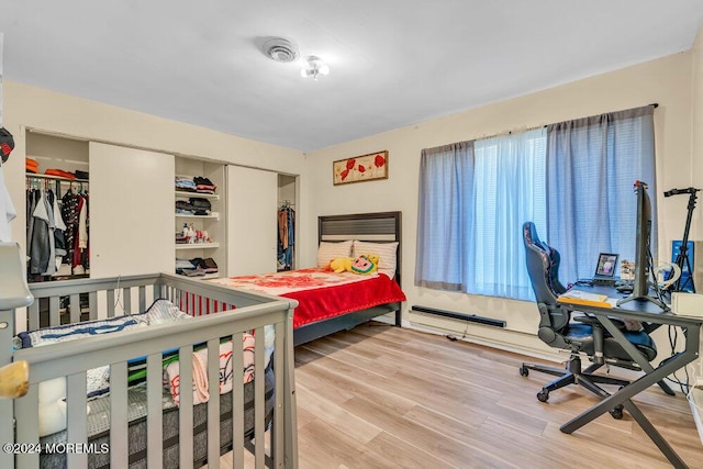 bedroom with light hardwood / wood-style floors