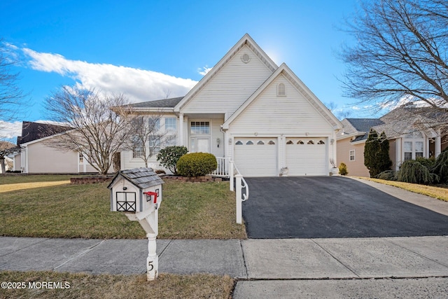 view of front facade with a garage and a front yard