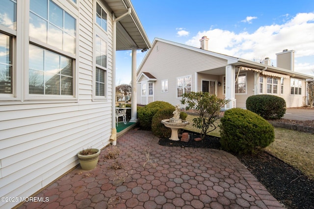 view of side of property featuring a patio