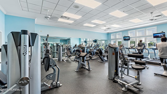 workout area with a drop ceiling and crown molding