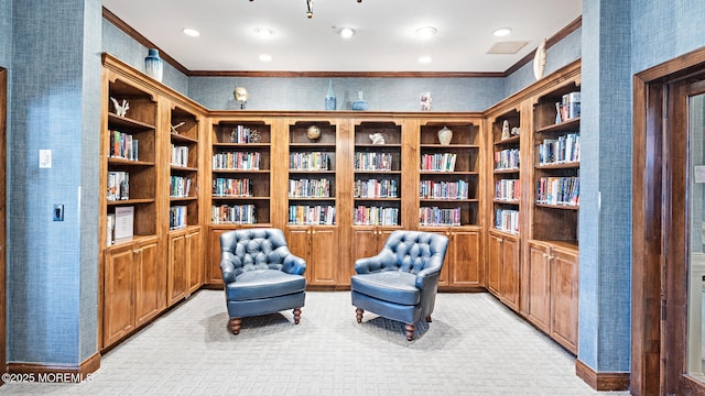 living area featuring ornamental molding and light colored carpet