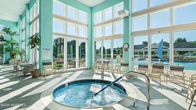 view of pool featuring an indoor hot tub