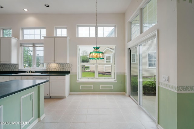 5 Shoal Dr, Barnegat, NJ 08005 - kitchen featuring decorative backsplash, dark countertops, dishwasher, recessed lighting, and a towering ceiling