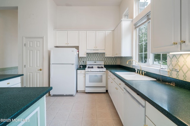 5 Shoal Dr, Barnegat, NJ 08005 - kitchen with white appliances, under cabinet range hood, white cabinets, dark countertops, and a towering ceiling