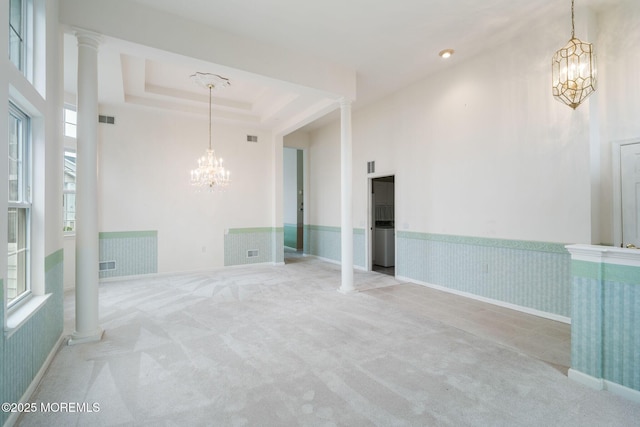 5 Shoal Dr, Barnegat, NJ 08005 - spare room with a chandelier, carpet flooring, decorative columns, a towering ceiling, and a tray ceiling