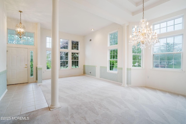 5 Shoal Dr, Barnegat, NJ 08005 - carpeted foyer entrance with a chandelier, plenty of natural light, and decorative columns