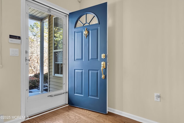 foyer entrance with hardwood / wood-style flooring