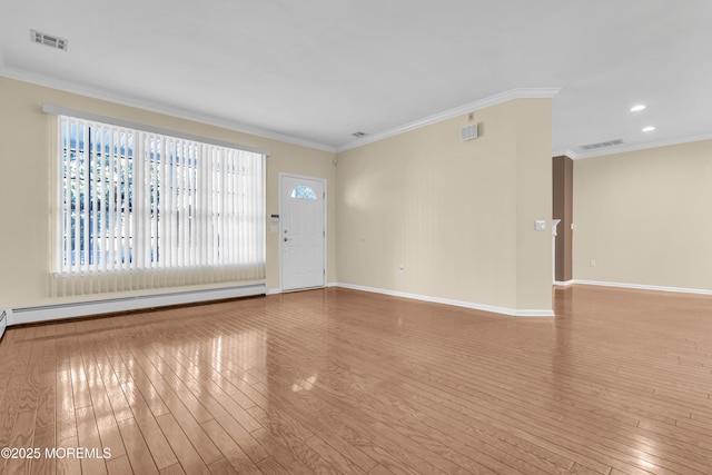 unfurnished living room with baseboard heating, crown molding, and light hardwood / wood-style flooring